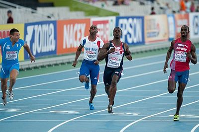 What is Dwain Chambers' best time for 100 metres?