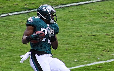 How many rushing yards did McCoy achieve in his first college year?