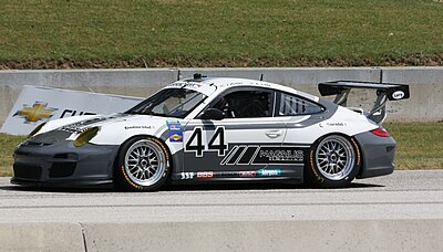 What is the model of the car that Andy Lally drives for Magnus Racing?