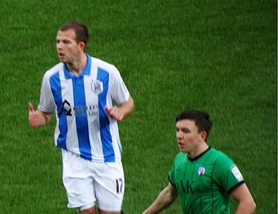 What was the name of the team Jordan Rhodes was playing for when he became the top scorer in England in the 2011-2012 season?