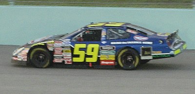 In what year did Ambrose win his last race at Watkins Glen in the Sprint Cup Series?