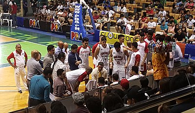 Who was the first head coach of Barangay Ginebra San Miguel?