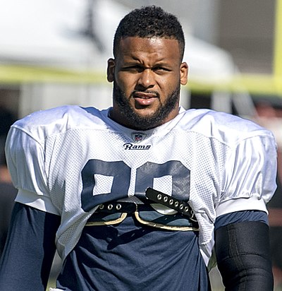 Did Aaron Donald receive unanimous All-American honors in college?