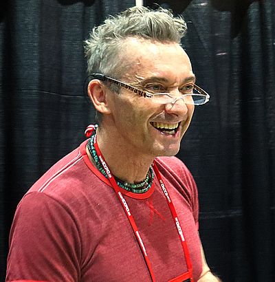 Cam Clarke provided voices for which genre of video games?
