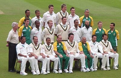 Which policy led to an international ban on the South African cricket team?