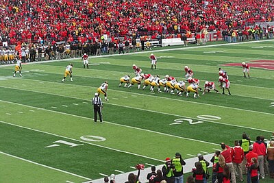 What is the name of the stadium where the Nebraska Cornhuskers football team plays its home games?
