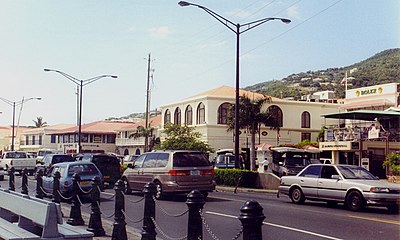 What is the name of the island that protects the harbor of Charlotte Amalie?