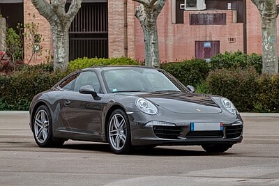 Which Porsche model is known for its rear-engine layout?