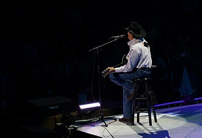 What year did George Strait surpass Conway Twitty's record for most number-one hits?