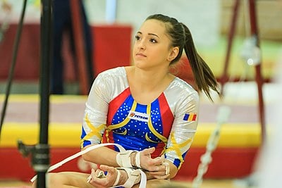 In what year did Larisa Iordache win the World silver medal in the all-around?