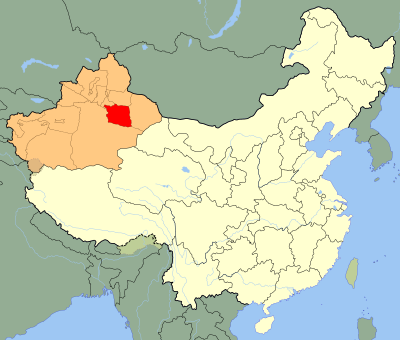 Which ancient Buddhist site is located near Turpan?