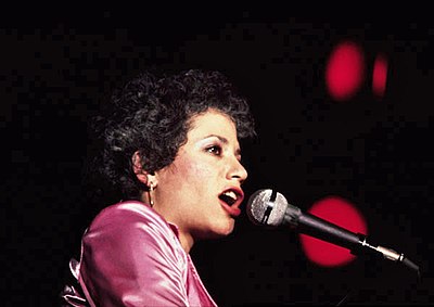 What genre is Janis Ian most associated with?