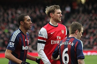 In his final seasons at Arsenal, why was Mertesacker's playing time limited?