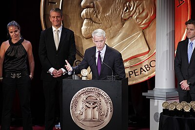 Which award did Cooper receive from the Overseas Press Club?