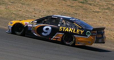 When was Marcos Ambrose born?