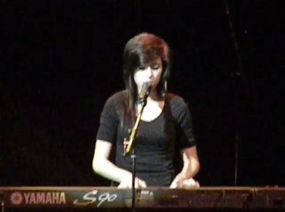 When did Christina Grimmie start posting covers of popular songs on YouTube?