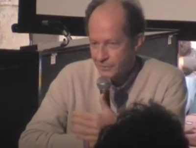 Which philosopher's work on biopolitics informs many of Agamben's writings?