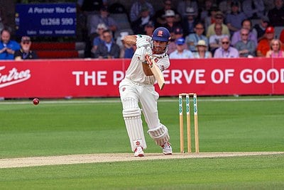 What is Cook's batting style?