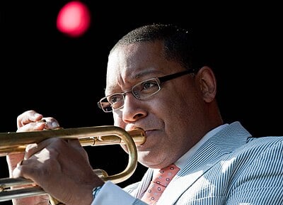 Which instrument does NOT feature prominently in Marsalis' performances?