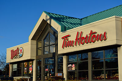 Who purchased Tim Hortons in 2014?