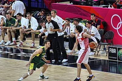 Who was the head coach of the team when they won bronze medals at EuroBasket 2011 and the 2012 Summer Olympics?