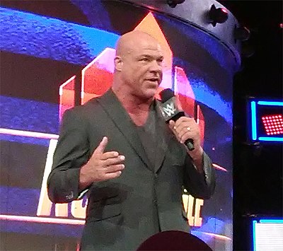 In which year did Kurt Angle sign with the World Wrestling Federation (WWF)?