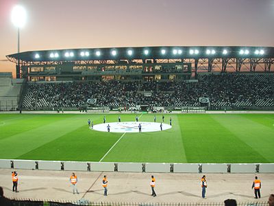 What is the seating capacity of PAOK's home stadium, Toumba Stadium?