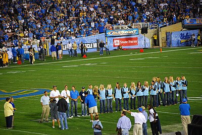 In which division do the UCLA Bruins men's and women's teams participate?