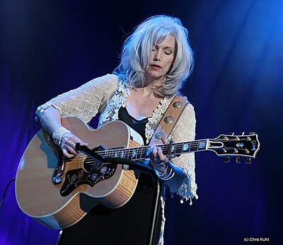 Aside from singing, does Emmylou Harris also write songs?