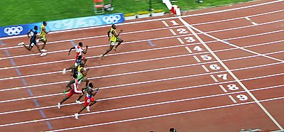 Which Jamaican athlete broke an Olympic and world record in all three of the events he participated in at the 2008 Summer Olympics?
