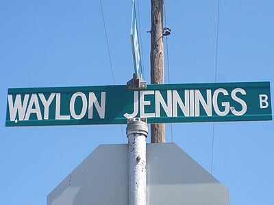 What was the name of Waylon Jennings's first band?