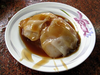 What is the name of the famous local street food that Tainan is known for?