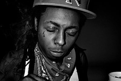 What genre best describes Lil Wayne?