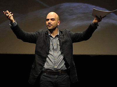 In which year did Roberto Saviano start living under police protection?