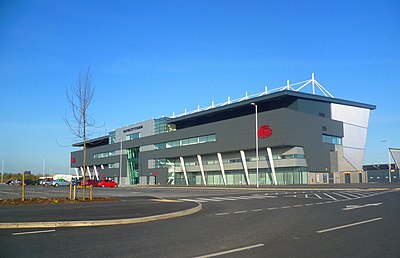 What was the name of Salford Red Devils' home ground before 2012?