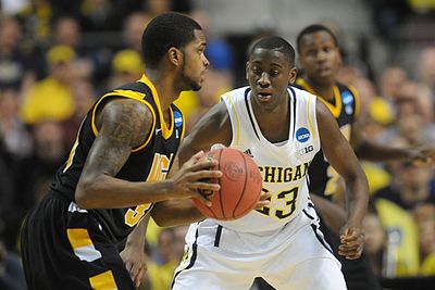 During his college career, Caris LeVert played in what conference?