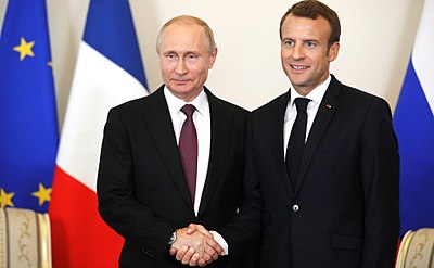 When was Emmanuel Macron awarded the Grand Cross Of The National Order Of Merit?