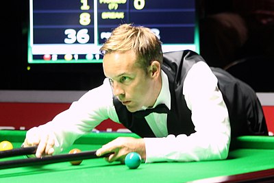 Against which player did Carter record his first win at the Crucible?