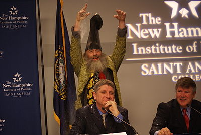 What large object is Vermin Supreme known to carry around?