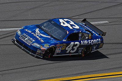 Which car did Reed Sorenson drive for Premium Motorsports?