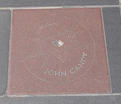 In which comedy troupe did John Candy first gain fame?