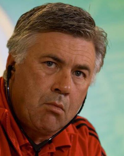 In which year did Ancelotti win Ligue 1 with Paris Saint-Germain?