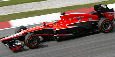 Which driver scored Marussia F1 Team's first championship points?