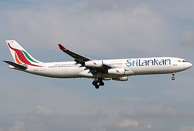 What was the name of SriLankan Airlines when it was partially acquired by Emirates in 1998?