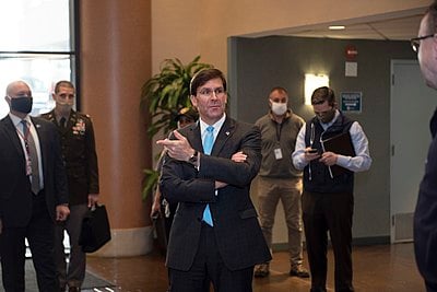 Before joining the Trump administration, Esper worked for which defense contractor?