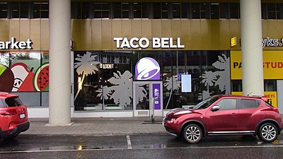 In which decade did Taco Bell introduce drive-thru service?