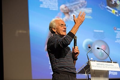 What day of the year was Gérard Mourou born?
