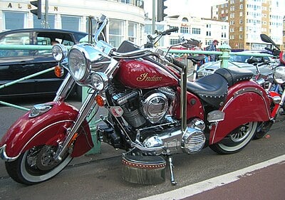 Which American automotive manufacturer currently owns the Indian Motorcycle brand?