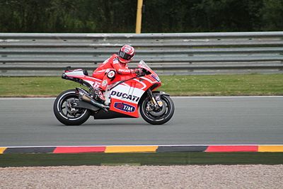In MotoGP, Hayden ended Rossi's streak of consecutive titles; how many did Rossi win?