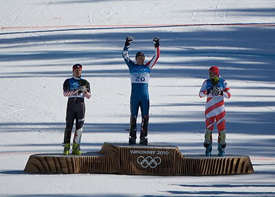 Which year did Bode win both the super combined gold and downhill bronze?
